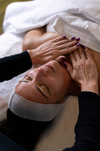 Woman relaxes and recharges with a massage in a recovery studio.